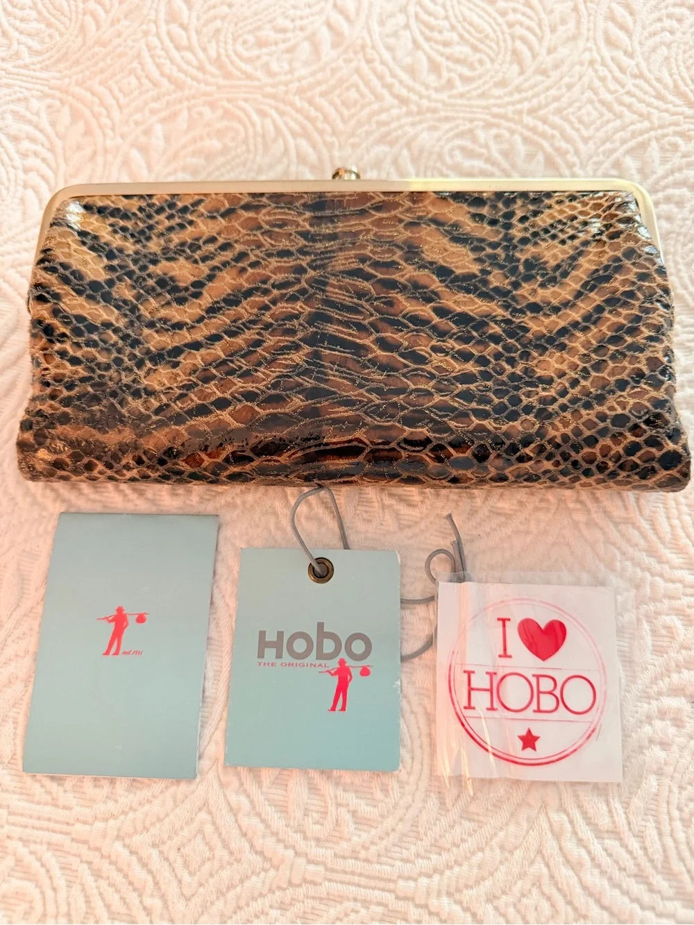 HOBO Animal-Print Snake-Embossed Frame Clutch in Black and Brown